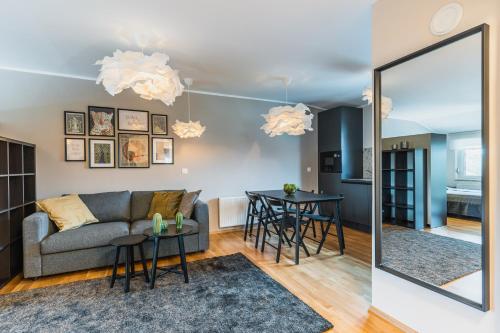 a living room with a couch and a table at Vila Valentina in Ljubljana