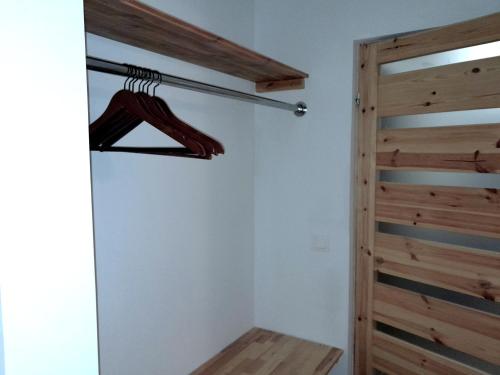 a room with a closet and a wooden door at Sowinka in Lutowiska