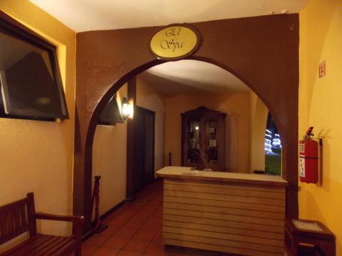 an entry way to a restaurant with a sign on the wall at Casa Cantarranas in Tehuacán