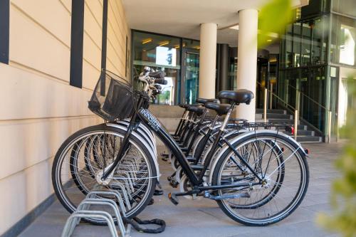 a group of bikes parked next to a building at INNSiDE by Meliá Dresden in Dresden