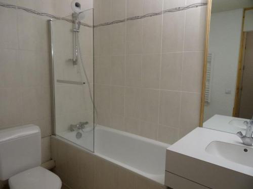 a bathroom with a shower and a toilet and a sink at Appartement Valmorel, 3 pièces, 8 personnes - FR-1-291-766 in Valmorel