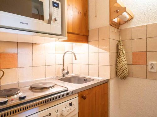 a kitchen with a sink and a microwave at Appartement Valmorel, 1 pièce, 4 personnes - FR-1-291-769 in Valmorel
