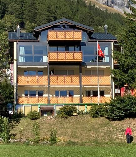 a building with a flag in front of it at Diana 9 in Leukerbad