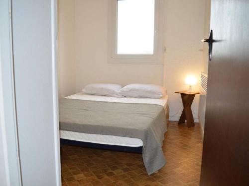 En eller flere senger på et rom på Appartement Saint-Cyprien, 2 pièces, 4 personnes - FR-1-225D-440