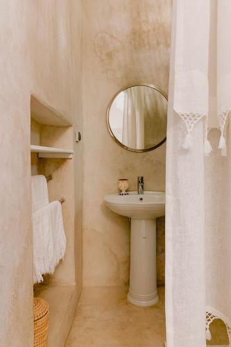 a bathroom with a sink and a mirror at Riad Maison 24 in Marrakesh