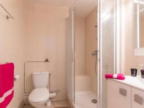 a white bathroom with a toilet and a shower at Studio fonctionnel avec coin montagne, proche remontées mécaniques et centre commercial, 4 couchages - FR-1-330F-66 in Serre Chevalier