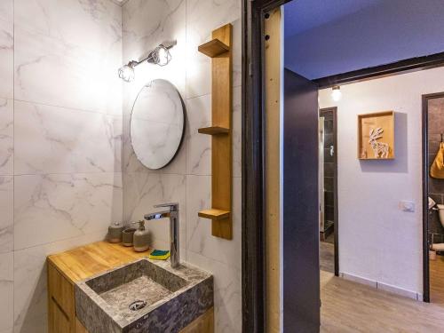 a bathroom with a sink and a mirror at Appartement chaleureux 8 pers, 3 chambres, proche pistes à Eaux-Bonnes - FR-1-400-35 in Gourette