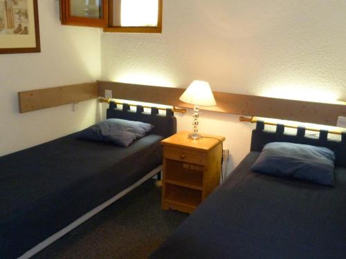 Giường trong phòng chung tại Appartement Les Arcs 1800, 2 pièces, 4 personnes - FR-1-411-122