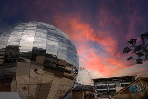a domed building with a cloudy sky in the background at Clayton Hotel Bristol City in Bristol