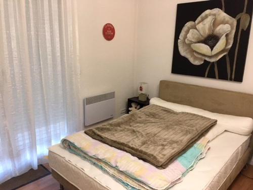 a bedroom with a bed with a blanket on it at Appartement La Mongie, 3 pièces, 4 personnes - FR-1-404-200 in La Mongie