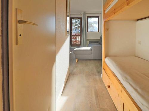 a tiny house with a bed and a living room at Studio Montvalezan-La Rosière, 1 pièce, 4 personnes - FR-1-398-623 in Montvalezan