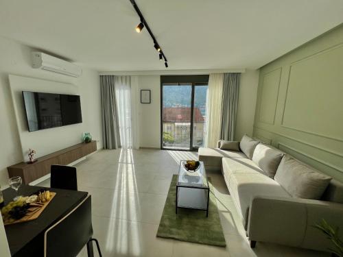 a living room with a couch and a table at Solaris Lux Apartments in Kotor