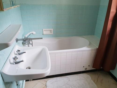 a bathroom with a sink and a bath tub at Chalet Arêches-Beaufort, 6 pièces, 12 personnes - FR-1-342-198 in Arêches