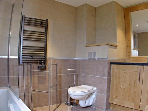 a bathroom with a toilet and a sink and a tub at Appartement Valmorel, 4 pièces, 8 personnes - FR-1-291-833 in Valmorel