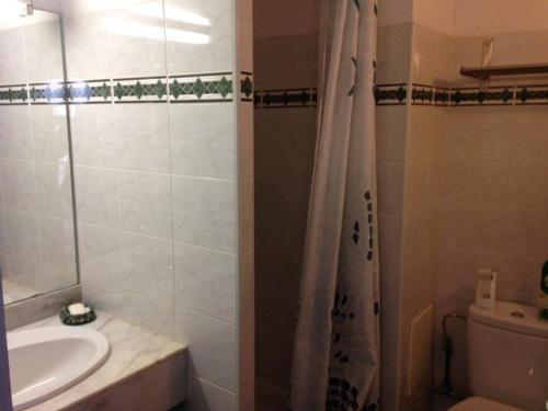a bathroom with a sink and a toilet and a shower at Appartement Vieux-Boucau-les-Bains, 3 pièces, 5 personnes - FR-1-379-115 in Vieux-Boucau-les-Bains