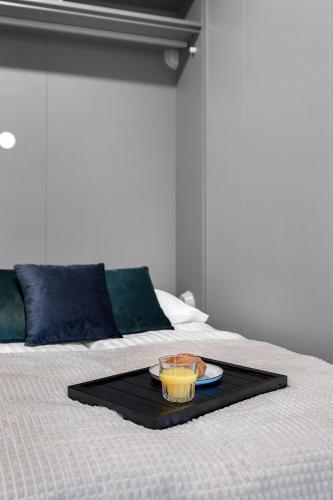 Una cama o camas en una habitación de B 18-20 Apartments