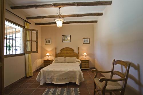 Säng eller sängar i ett rum på Villa La Clavelina Rocabella