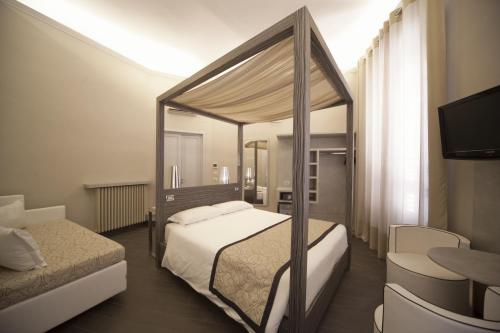 Krevet ili kreveti u jedinici u okviru objekta B&B Residenza le Fonticine