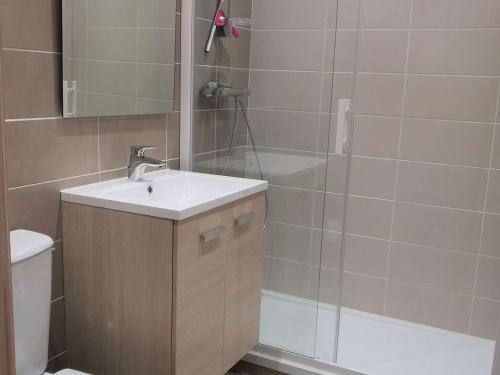 a bathroom with a sink and a shower and a toilet at Studio cabine 4 pers. La Mongie, centre station, près des pistes - FR-1-404-333 in La Mongie