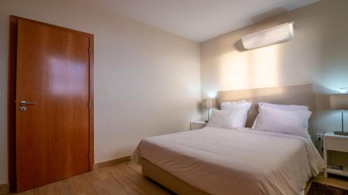 Ένα ή περισσότερα κρεβάτια σε δωμάτιο στο Madeira Inn Refugio do Sol