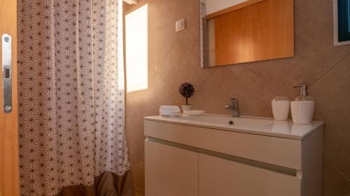 Ένα μπάνιο στο Madeira Inn Refugio do Sol