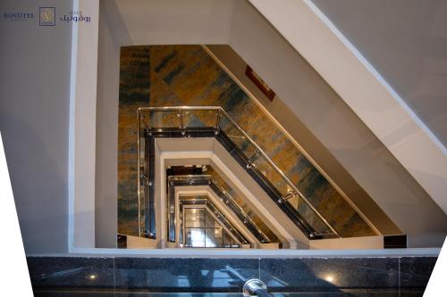 a view of a spiral staircase in a building at Romera Hotel in Jeddah