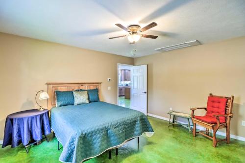 a bedroom with a bed and a ceiling fan at Brand New Cotter Home, Walk to Trout Fishing! in Cotter