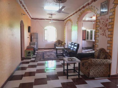 a living room with a checkered floor at Algaafary GeustHouse in Aswan