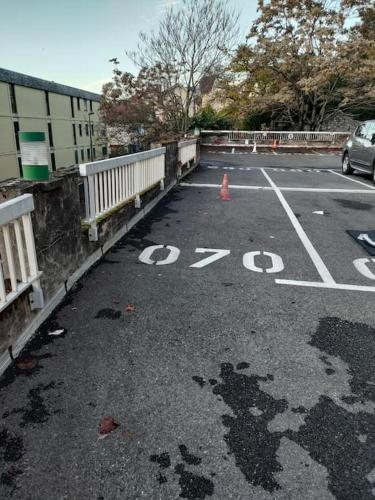 a parking lot with a car on a bridge at Magnifique 3 étoiles en hyper centre avec place privée in Aix-les-Bains