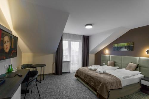 Postel nebo postele na pokoji v ubytování Pensjonat Śnieżka SPA