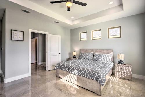 a bedroom with a bed and a ceiling fan at Stunning Laguna Vista Retreat with Pool and Grill in Laguna Vista