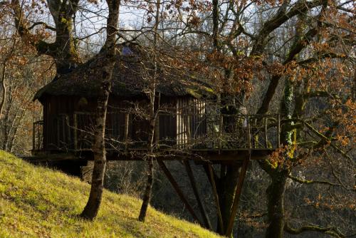 a tree house sitting on top of a hill at Les Cabanes de Brassac in Brassac