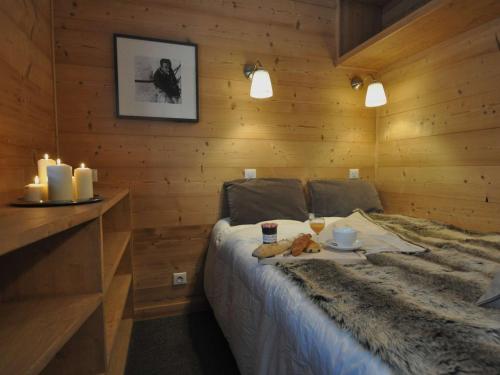 Giường trong phòng chung tại Appartement Val Thorens, 3 pièces, 4 personnes - FR-1-545-17