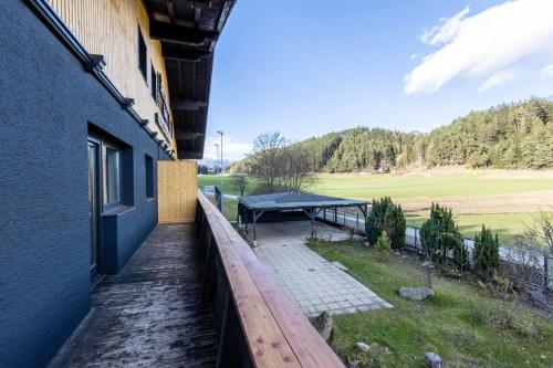 a balcony of a building with a picnic table at The Art and Sporthotel in Innsbruck