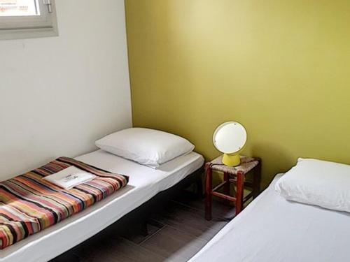 Postelja oz. postelje v sobi nastanitve Appartement Bormes-les-Mimosas, 4 pièces, 6 personnes - FR-1-610-31