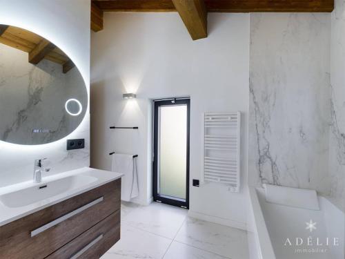 a white bathroom with a sink and a mirror at Chalet Montvalezan-La Rosière, 6 pièces, 10 personnes - FR-1-398-633 in Montvalezan