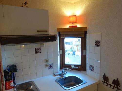 a kitchen with a sink and a window at Studio Cosy au Cœur d'Arêches-Beaufort, Proche Pistes & Commerces, Idéal Couple + Enfant - FR-1-342-253 in Beaufort