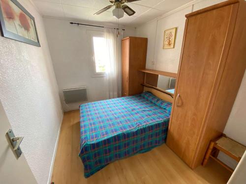 Säng eller sängar i ett rum på Appartement Port Leucate, 3 pièces, 5 personnes - FR-1-81-546