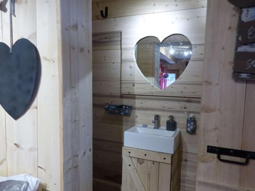 a bathroom with a sink and a mirror at Chalet Hauteluce, 2 pièces, 3 personnes - FR-1-342-263 in Hauteluce