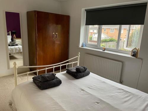 a bedroom with a bed with two pillows on it at Manchester 2 Bedroom House with Garden in Manchester