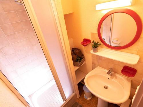 a bathroom with a shower and a sink and a mirror at Confort et Accès Facile : Proche Télécabine, 2 Chambres - FR-1-296-364 in Saint-Lary-Soulan