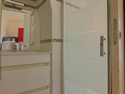 a bathroom with a shower and a sink and a mirror at Appartement Ajaccio, 1 pièce, 2 personnes - FR-1-61-473 in Ajaccio