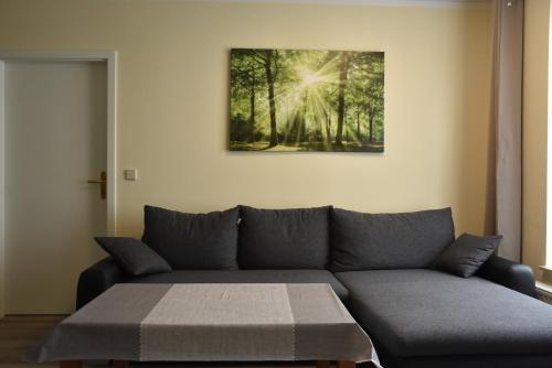 a living room with a couch and a table at Hotel Garni Am Klostermarkt in Plauen