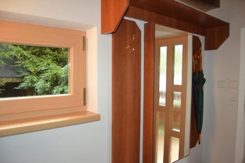 a door with a window in a room at Chata Dolce in Trutnov
