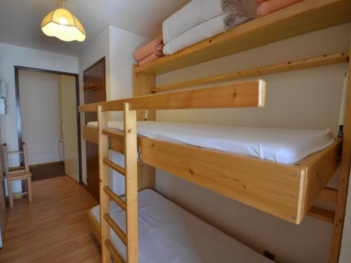 a room with two bunk beds and a hallway at Appartement Notre-Dame-de-Bellecombe, 2 pièces, 4 personnes - FR-1-505-29 in Notre-Dame-de-Bellecombe