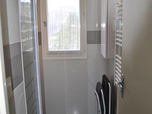 a bathroom with a window and chairs in it at Appartement Montgenèvre, 2 pièces, 6 personnes - FR-1-266-145 in Montgenèvre