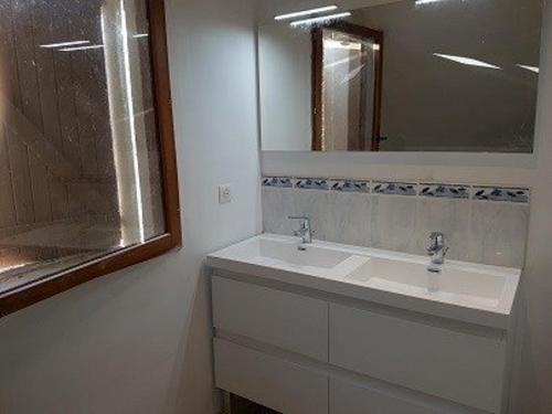 a bathroom with a sink and a mirror at Maison Cauterets, 9 pièces, 15 personnes - FR-1-234-244 in Cauterets