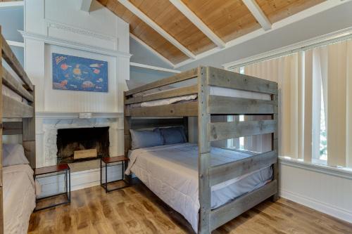 a bedroom with a bunk bed and a fireplace at 4 bedroom house with a pool in Reseda