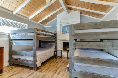 two bunk beds in a room with wooden floors at 4 bedroom house with a pool in Reseda