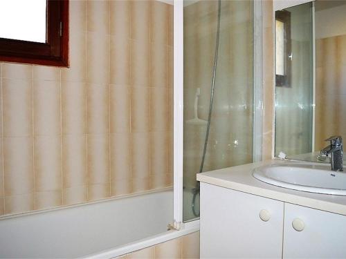 a bathroom with a sink and a shower at Appartement Les Angles, 2 pièces, 4 personnes - FR-1-593-1 in Les Angles